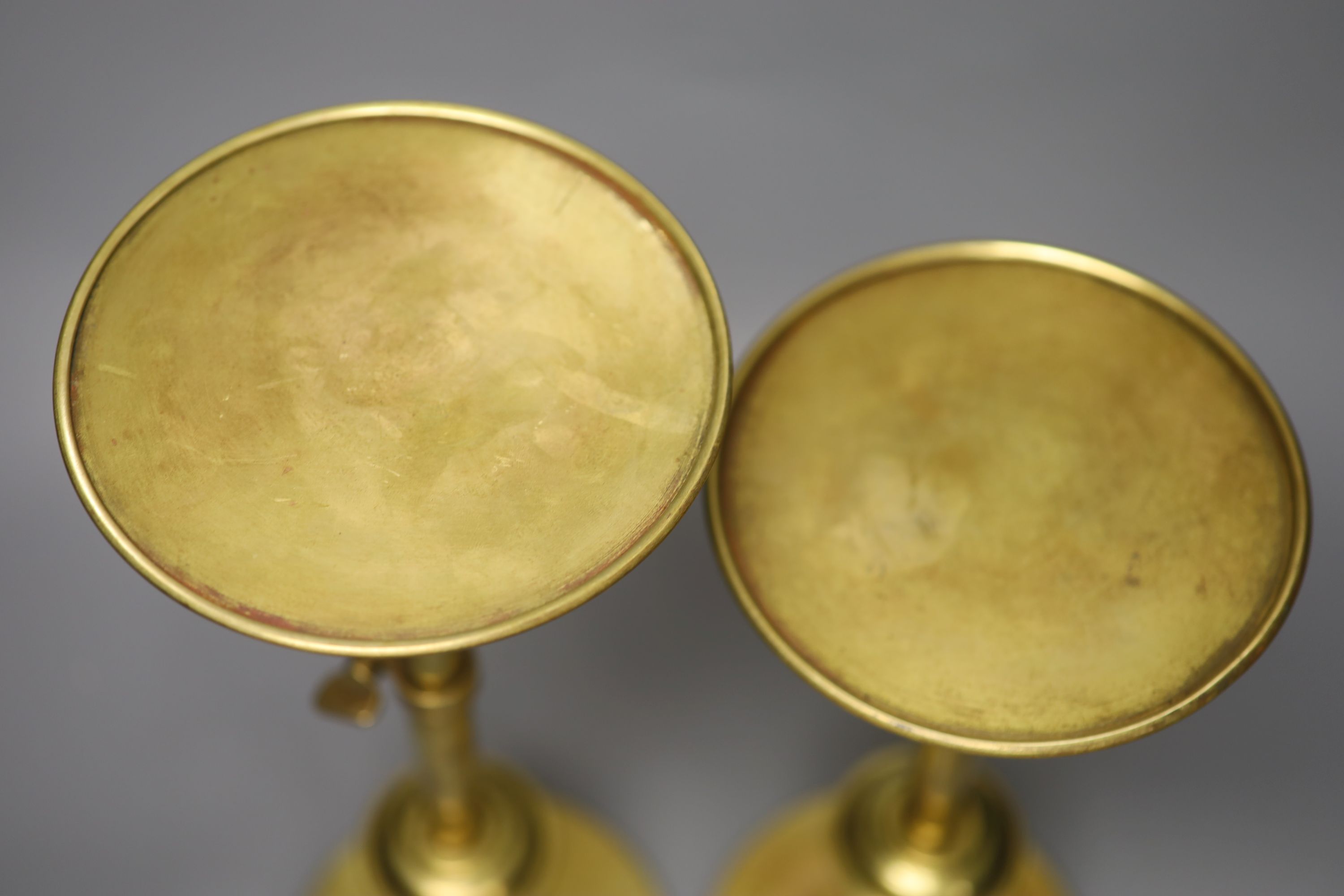 A pair of brass telescopic display stands